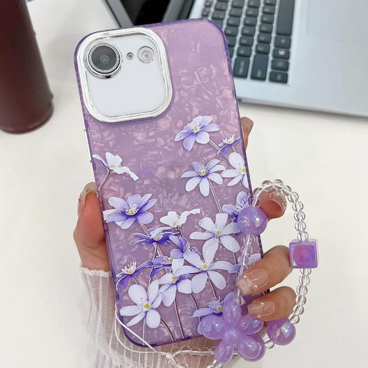 For iPhone 16e Electroplating Flowers Plants Texture Wristband TPU Phone Case(Lilac Flowers FL16) - iPhone 16e Cases by PMC Jewellery | Online Shopping South Africa | PMC Jewellery | Buy Now Pay Later Mobicred